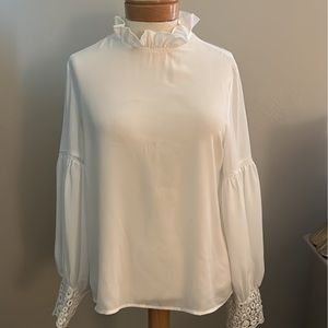 She in sheer top with lace accents